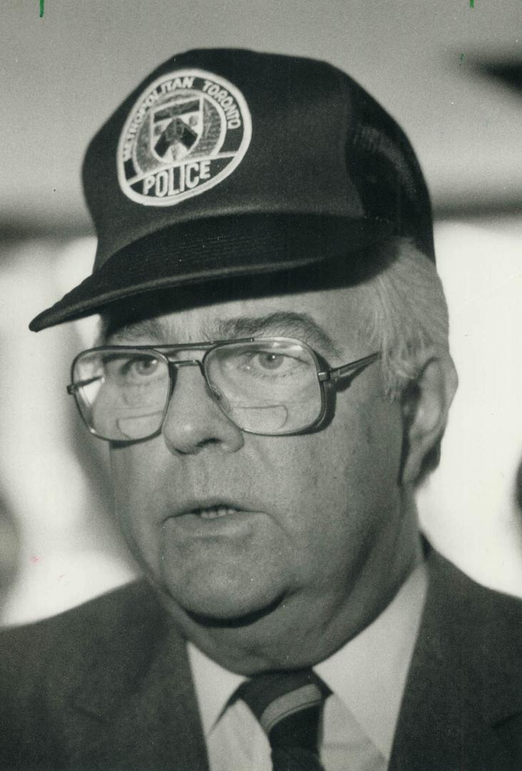 John Crosbie. Donned Metro police cap at luncheon speech on seizing profits of crime