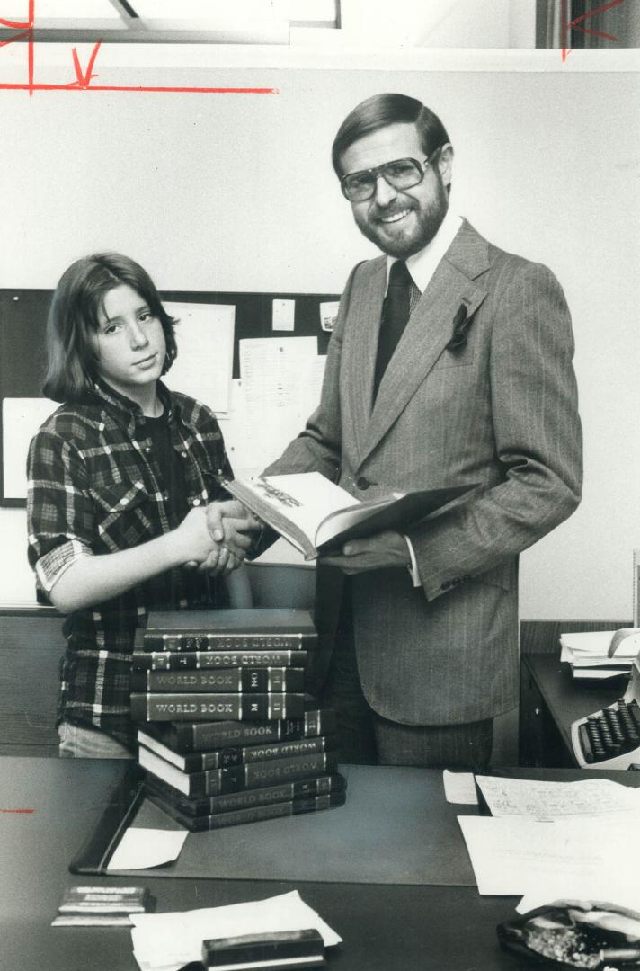 Executive editor Tom Curzon presents prize to Scott Leach, 15