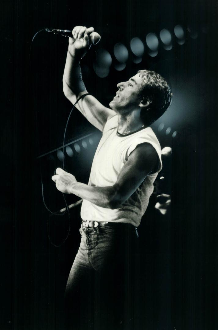 Good times. This happy fan seems to be responding tothe magnetic performance of The Who's lead singer Roger Daltrey (right) at concert in Exhibition S(...)