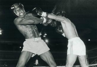 Straight left: Asif Dar (right) jabs Errol Farquarsonn at Varsity Arena last week