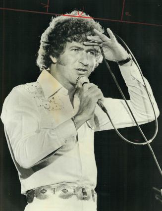 Texas singer Mac Davis. He saved Grandstand show last night