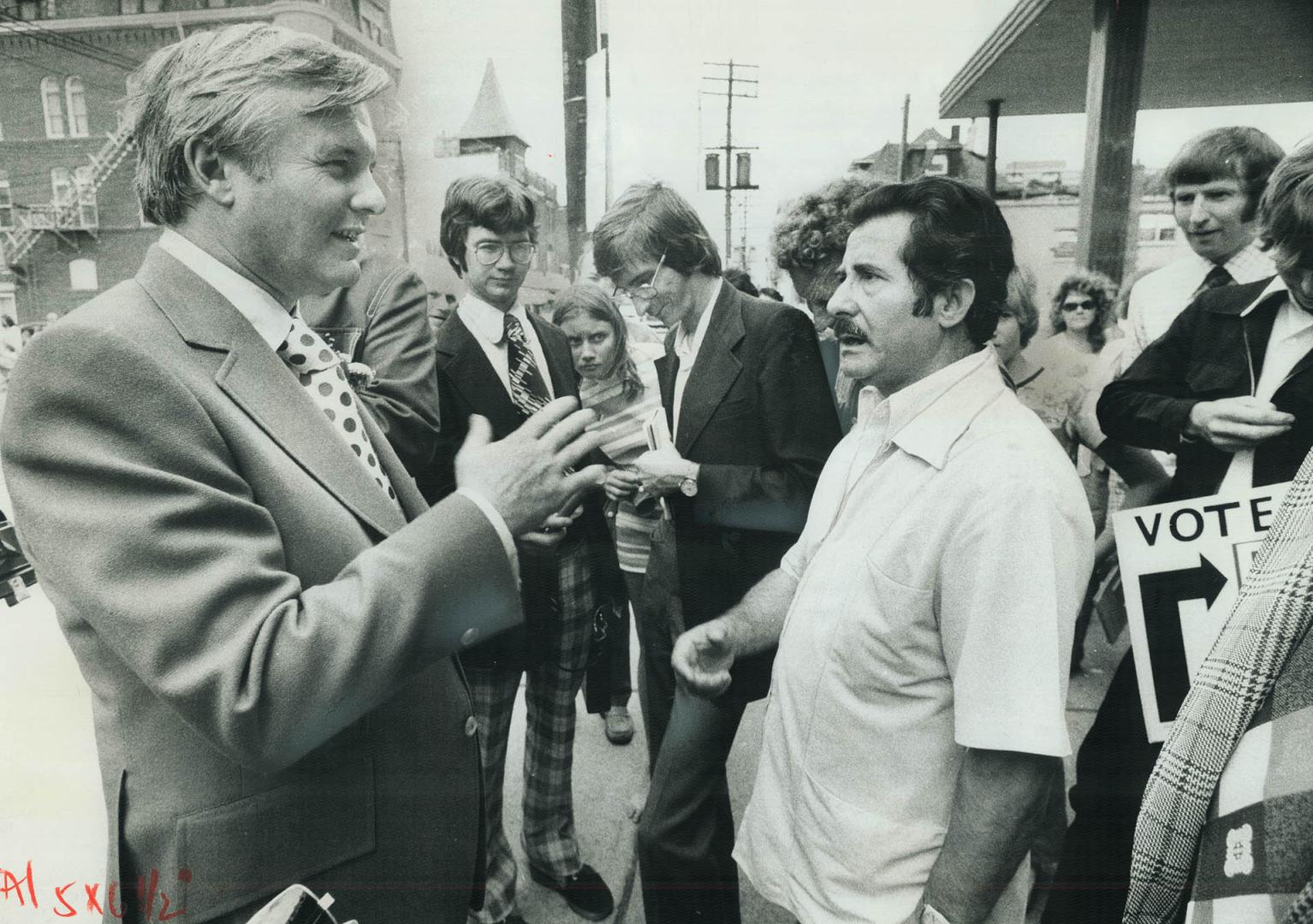 He'd clip the Premier. While strolling along Queen St. W. yesterday, Premier William Davis was confronted by Doura Makos, right, who complained that t(...)