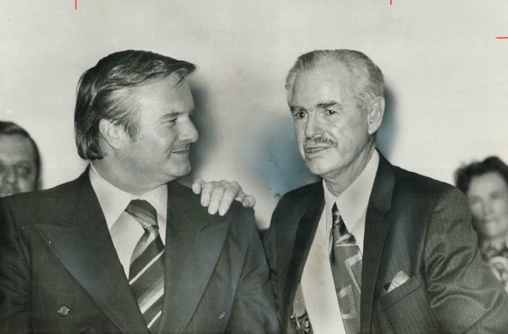 Enjoying a laugh, Premier William Davis listens to Ernest Majury at Peel Children's Aid Society annual meeting which honored Majury, who is retiring a(...)