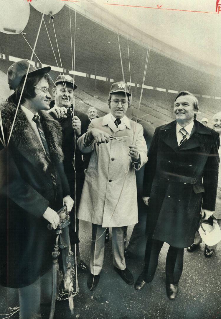 Metro Chairman Paul Godfrey leans on air hammer and Ontario Premier William Davis, right, watches as Scarborough controller Ken Morrish and Toronto al(...)