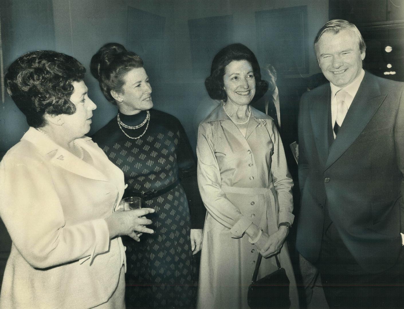 Women members of Ontario's new cabinet chat with Premier William Davis after being sworn in at Queen's Park