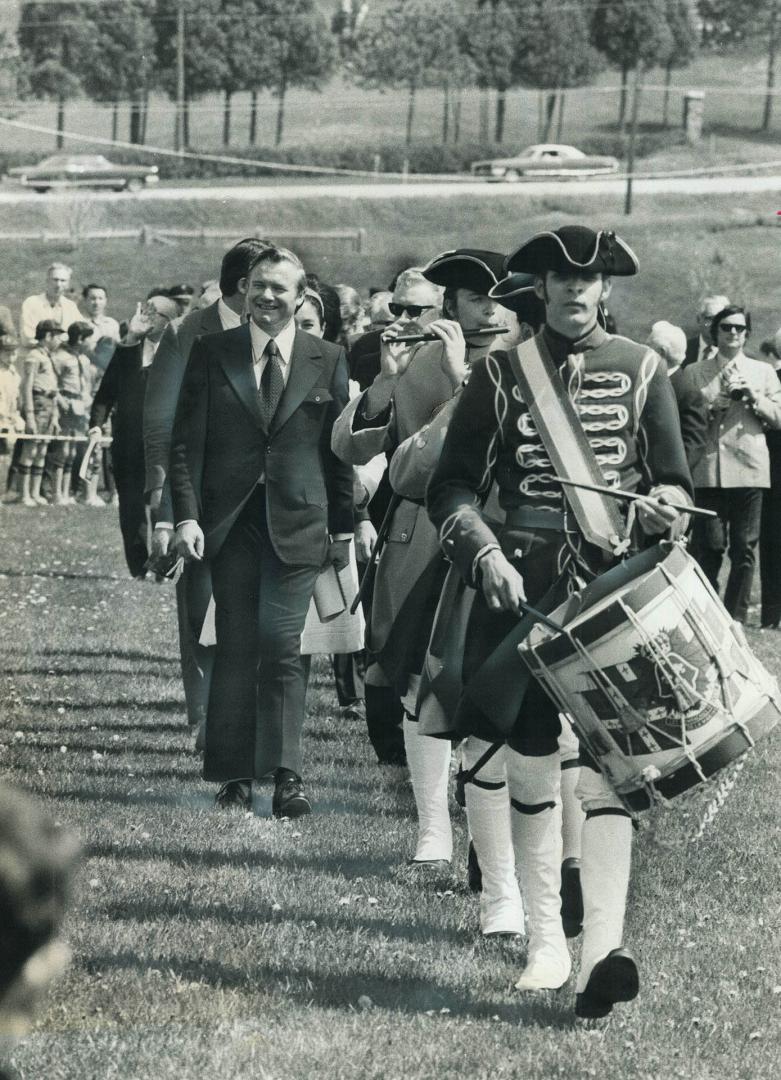 With flute and drum a color guard escorts Ontario Premier Williams Davis as he opens the $1,000-000 museum of Sainte-Marie-Among-the-Hurons on the sit(...)