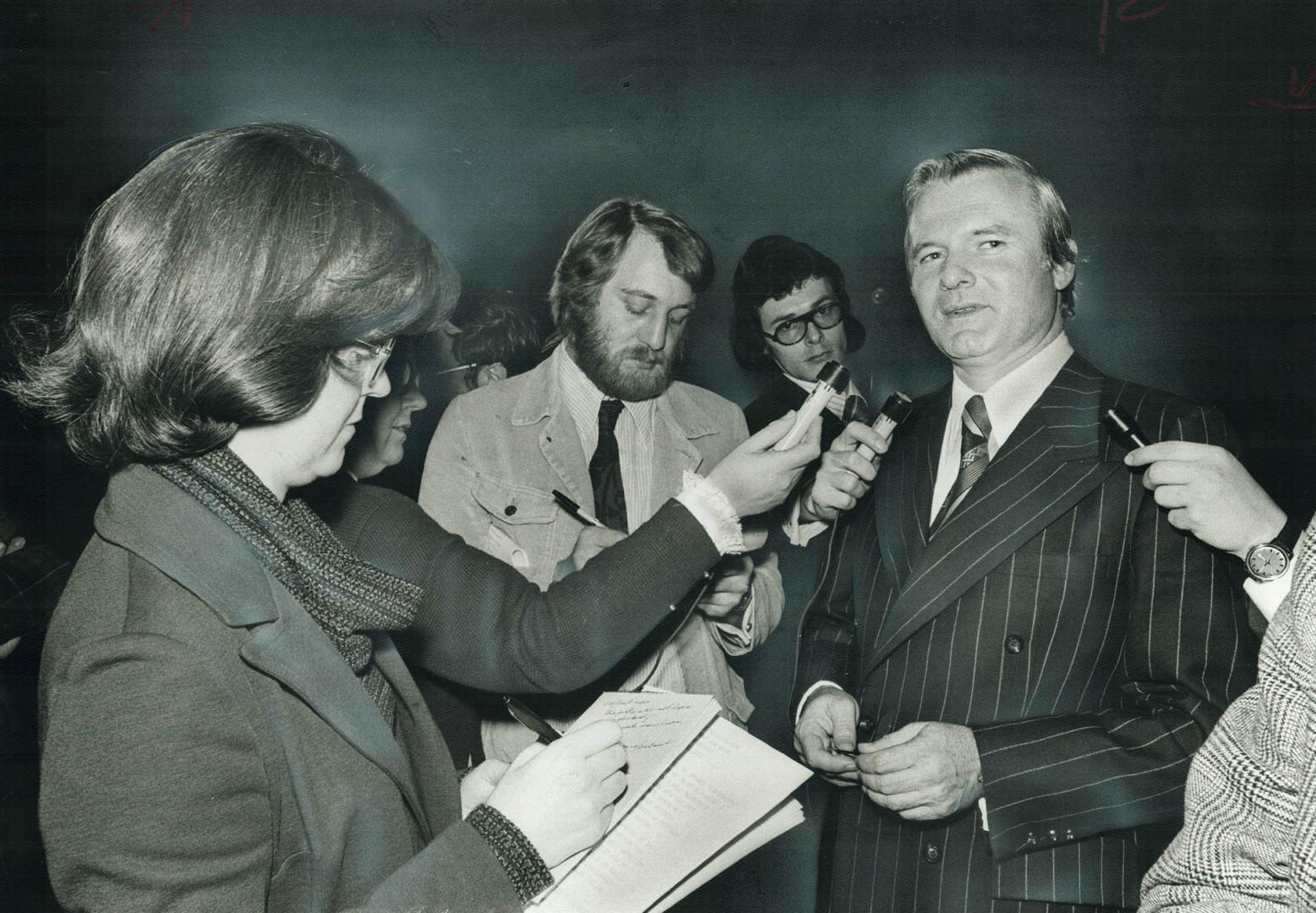 Ontario premier William Davis talks with reporters yesterday after the premier announced the government will withdraw the 7 per cent tax on energy announced in the April 12 provincial budget