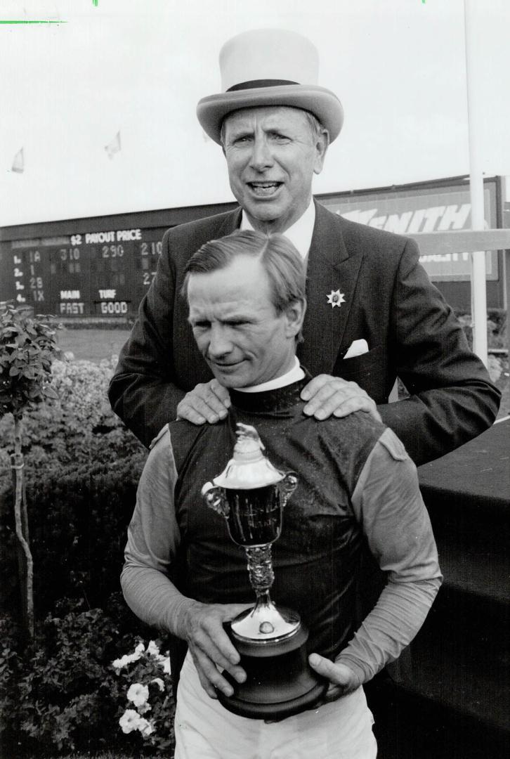 Champions: Owner Ernie Samuel and jockey Pat Day with Plate silverware