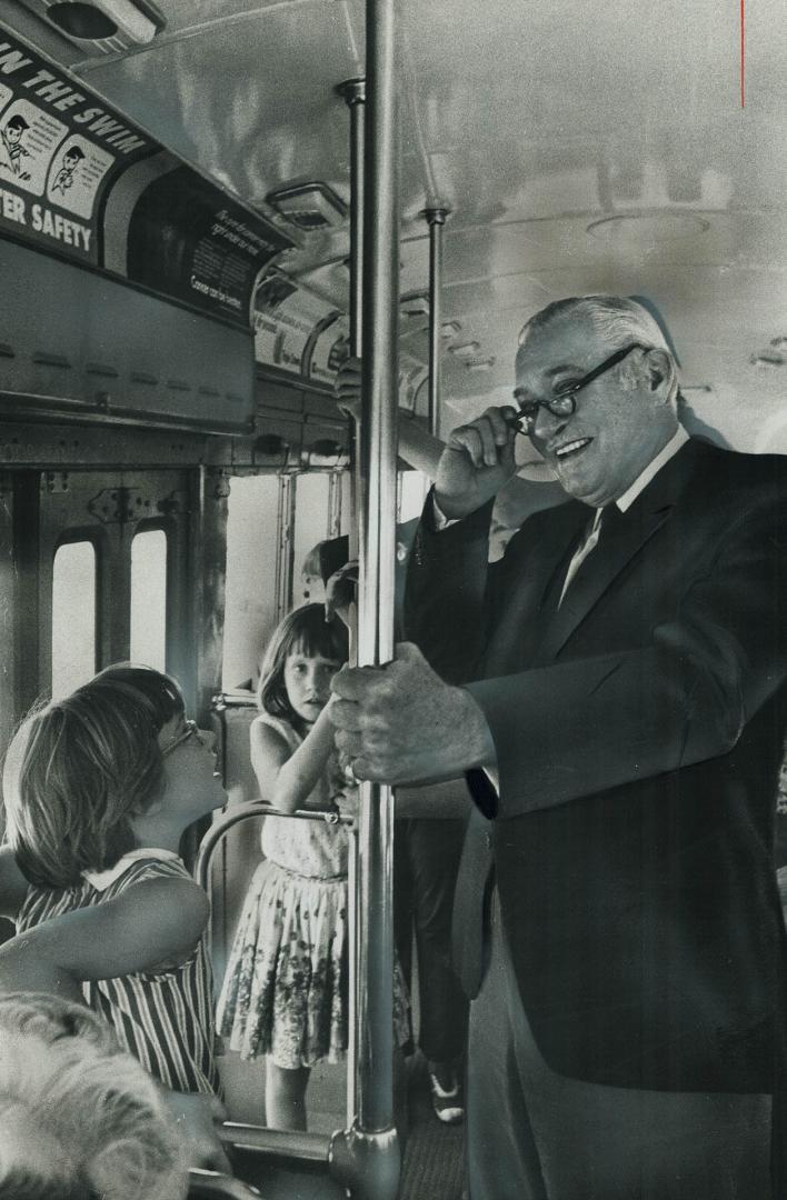 TTC boss Ralph Day rides the Queen St