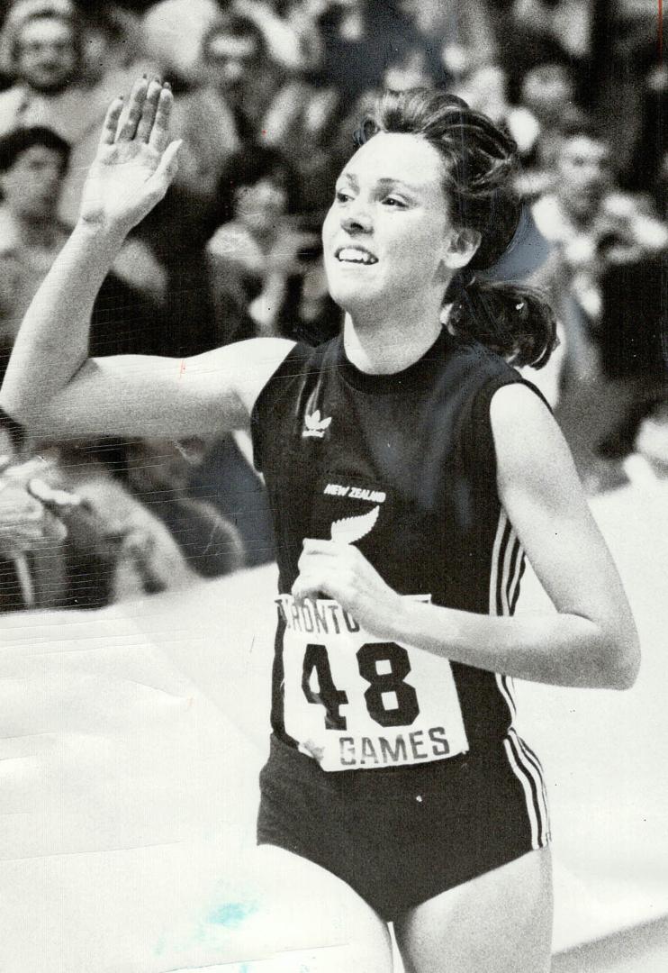 Victory wave. University of Colorado co-ed Mary Decker takes victory lap after winning 1,500 metres last night at Toronto Star Maple Leaf Indoor Games(...)