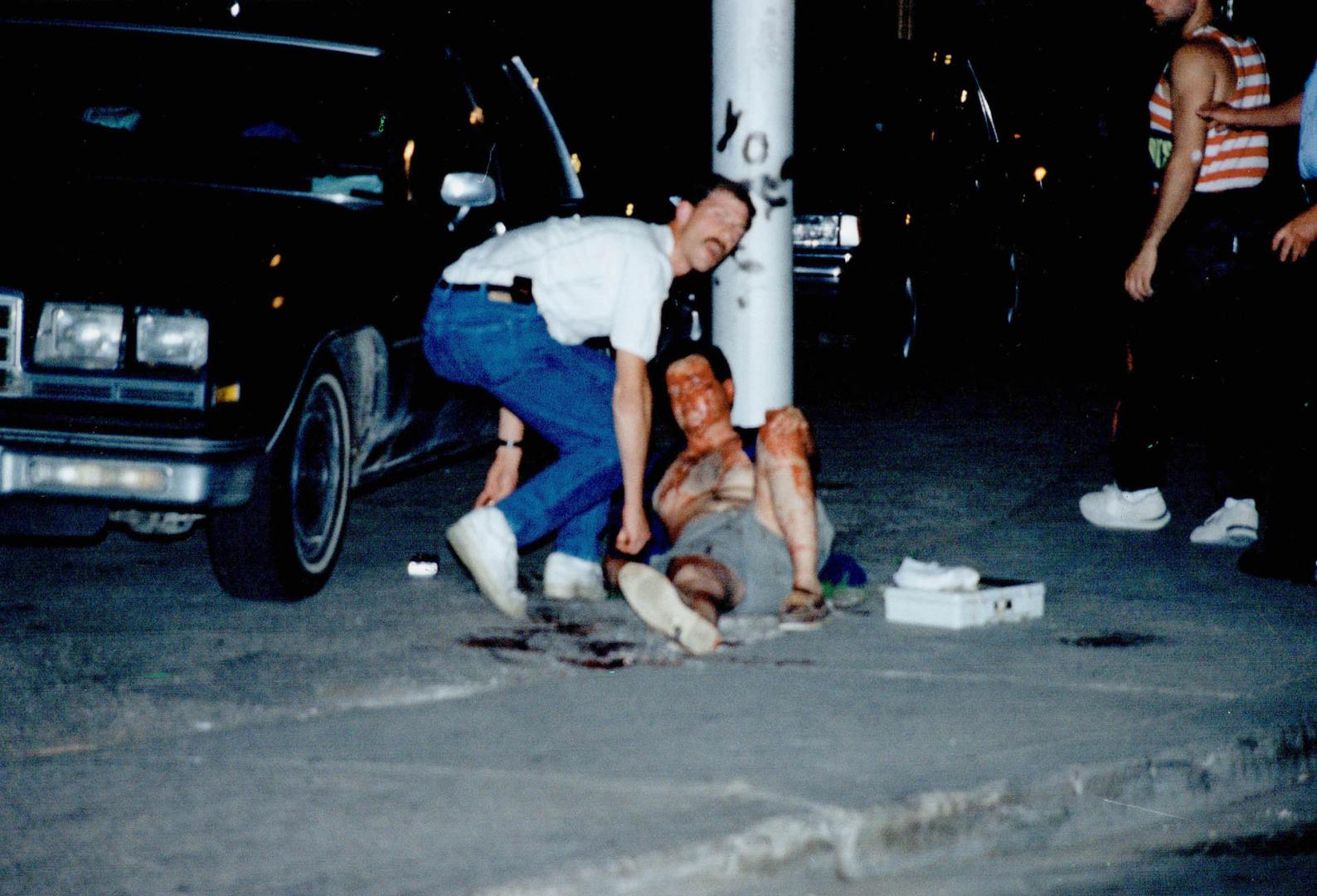 Officer down! Undercover police officer Larry Dee lies covered in blood after he was shot near Spadina Ave