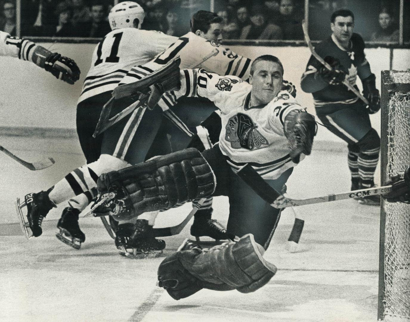 Acrobatic Netminder Denis Dejordy takes off into space to make spectacular save during game at Gardens Saturday night against Leafs. And, making sure (...)