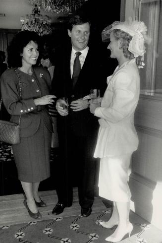 Far left, wearing a red Chanel suit is Marlene Del Zotto, talking with Leighton and Brenda McCarthy