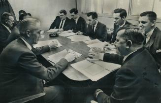 Union organizer Patrick O'Keefe (right foreground) sits at bargaining table with management of Ontario Housing Corp