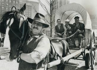 Mayor takes the reins of a red river cart