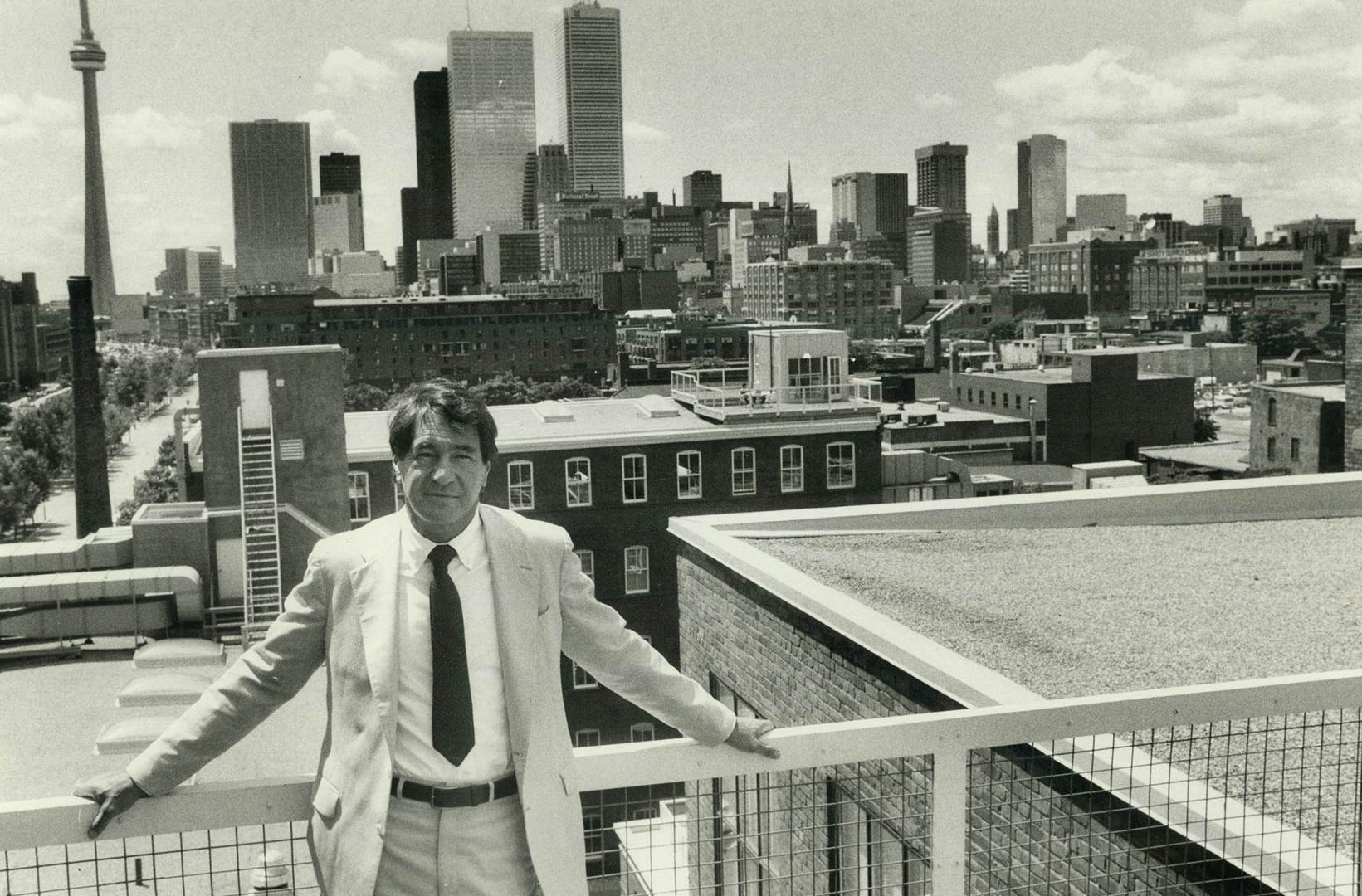 Before and after. Architect A. J. Diamond stands on the rooftop of Berkeley Castle, which he converted to offices. The building, shown unrenovated, housed Toronto's Toronto's first knitting mill