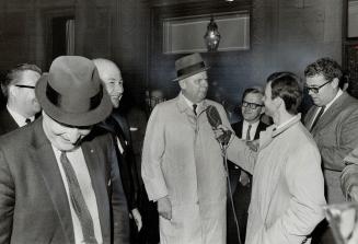 Diefenbaker ducks debate. Progressive Conservative leader John Diefenbaker meets the press outside Toronto's Albany Club yesterday. He refused to comm(...)