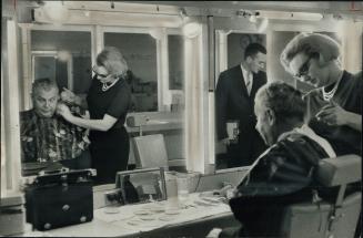 Carol Davidson applies pancake makeup to opposition leader Diefenbaker for TV appearance