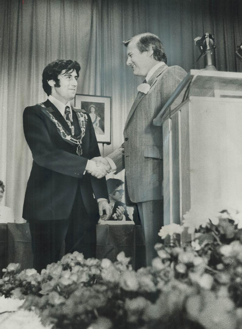 The first mayor of Mississauga, Dr. Martin Dobkin, is congratualted by Premier William Davis at the ceremonial inauguration yesterday in Glenforest Se(...)