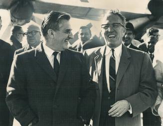 A Grinning Tommy Douglas arrives at Malton for tonight's Rally in Maple Leaf Gardens