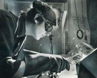 Sculptor Robert Downing welds a new work in his Dupont St