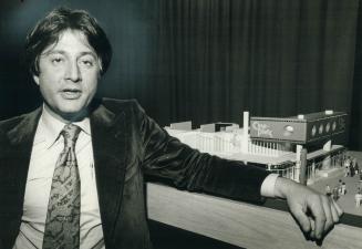 Garth Drabinsky, showbiz lawyer and movie entrepreneur whiz kid, with Cineplex scale model