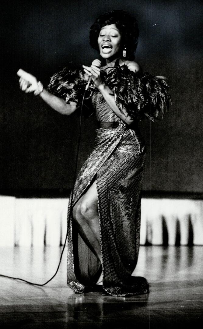 Hallelujah Ontario! Arlene Duncan, looking like Diana Ross, belts out a tune last night at the Convention Centre