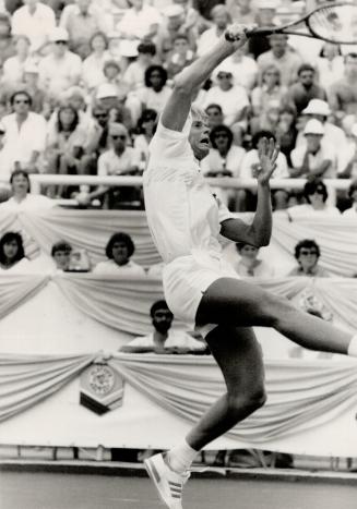 Take that! Sweden's Stefan Edberg hammers an overhead shot to Christo Steyn yesterday during semifinal action at the Player's International tournament. Edberg won, 6-1, 6-2