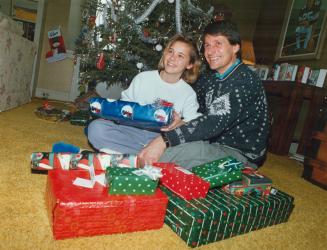 Happy holiday: Terry Evanshen, with his daughter Jennifer, 11, beat death and is home with his family for Christmas