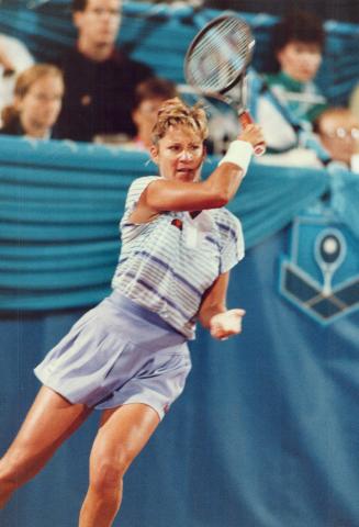 So long. Christ Evert slams a forehand during her last Toronto appearance a 6-4, 7-5 loss to Anne Minter last night in Player's Challenge tennis action