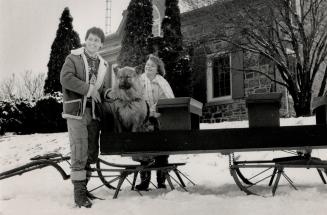 Happy Trio: Terry Evanshen seems to be enjoying himself as he and daughter Tracy Lee, 18, and the family dog Rebel, stand outside their stone farmhouse just north of Whitby