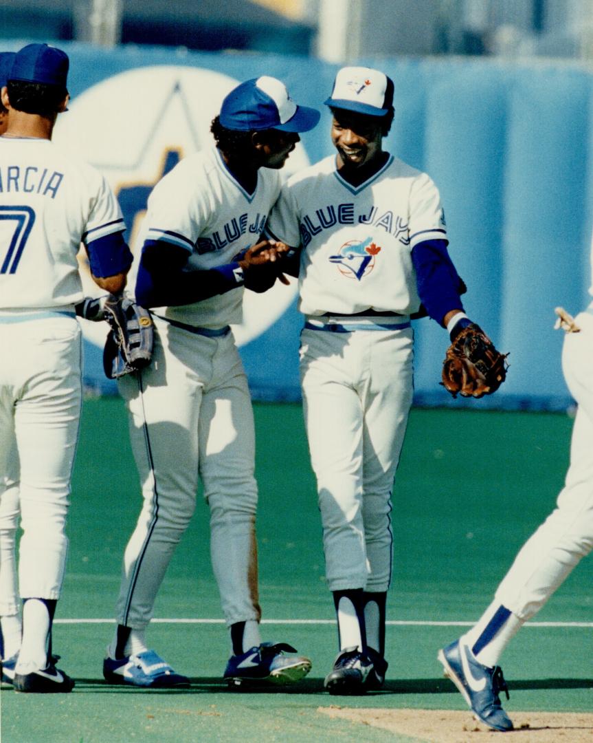 Longball power: Tony Fernandez, not usually noted for his home-run power, gets congratulated by Lloyd Moseby after his game-winning four-bagger against Baltimore yesterday