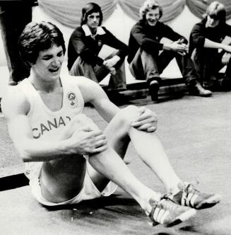 Forget is shown clearing the bar in his Canadian indoor record breaking jump, then raising his arms in happiness at his jump. With tears in his eyes h(...)