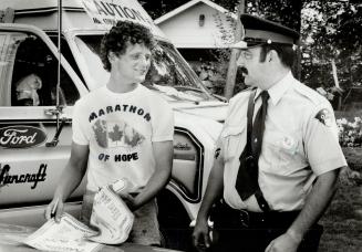 Fan in blue: Bala OPP Constable John Lennox escorted Terry Fox this week and described assignment as proudest of his life