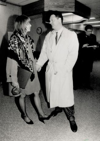 Day's end: Coach Charlie Francis enjoys a quiet moment yesterday with his fiancee, model Angela Coon, at the end of his fifth day of testimony before the Dubin inquiry