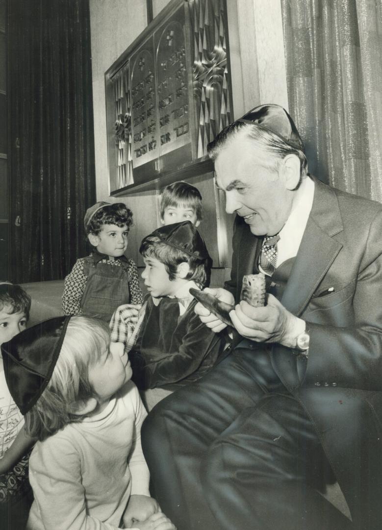 Young boys from the Beth Tzedec nursery school listen to Rabbi Benjamin Friedberg explain the purpose of the shofar, or ram's horn, sounded to mark th(...)