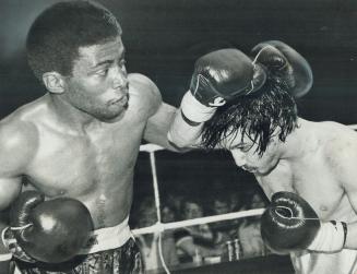 Nicky has to work for win. Toronto lightweight Nicky Furlano, right, ducks a left hook and goes on to win an eight-round decision over Tony Johnson of(...)