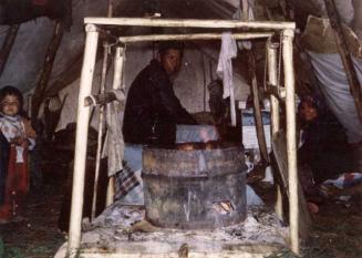 Family seated around fire