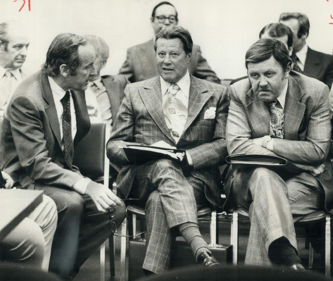 Hydro Chairman George Gathercole (centre) speaks yesterday as lawyer James McCallum (left) and Dennis Dack, a Hydro Public relations man, listen. Gath(...)