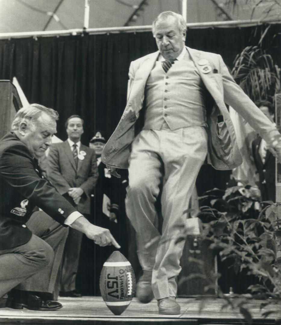 Heads up!: After years of playing upside down as a centre, CFL commissioner Jake Gaudaur got a rare chance to kick the ball as he launched Grey Cup luncheon ceremonies yesterday