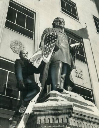 Canadian author Graeme Gibson stands beside statue of Egerton Ryerson today after draping U