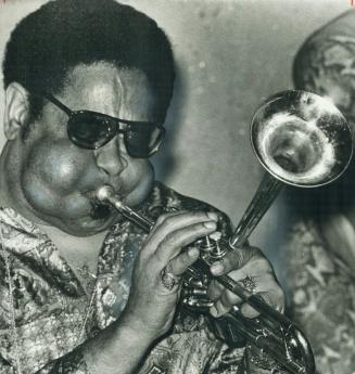 Dizzy Gillespie's phenomenal sense of rhythm makes heads nod and feet tap, says critic Eli Silas