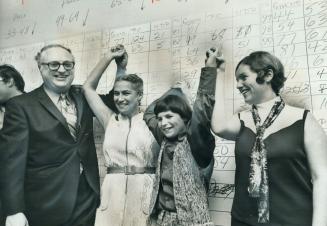 Former Toronto Mayor Phil Givens, who captured York-Forest Hill for the Liberals, jubilantly signals his victory with his wife, Min. It looks like we'(...)