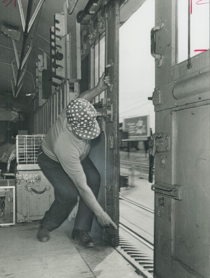 Baggageman Arthur Manders, 64, of the Canadian National Railways passenger train Lakeshore, points to the place a hold-up man entered the car yesterda(...)