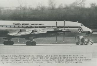 Fuelled for Cuba trip, a Canadian Forces Yukon transport plane stands waiting on the tarmac at the northwest corner of Dorval airfield, just outside M(...)