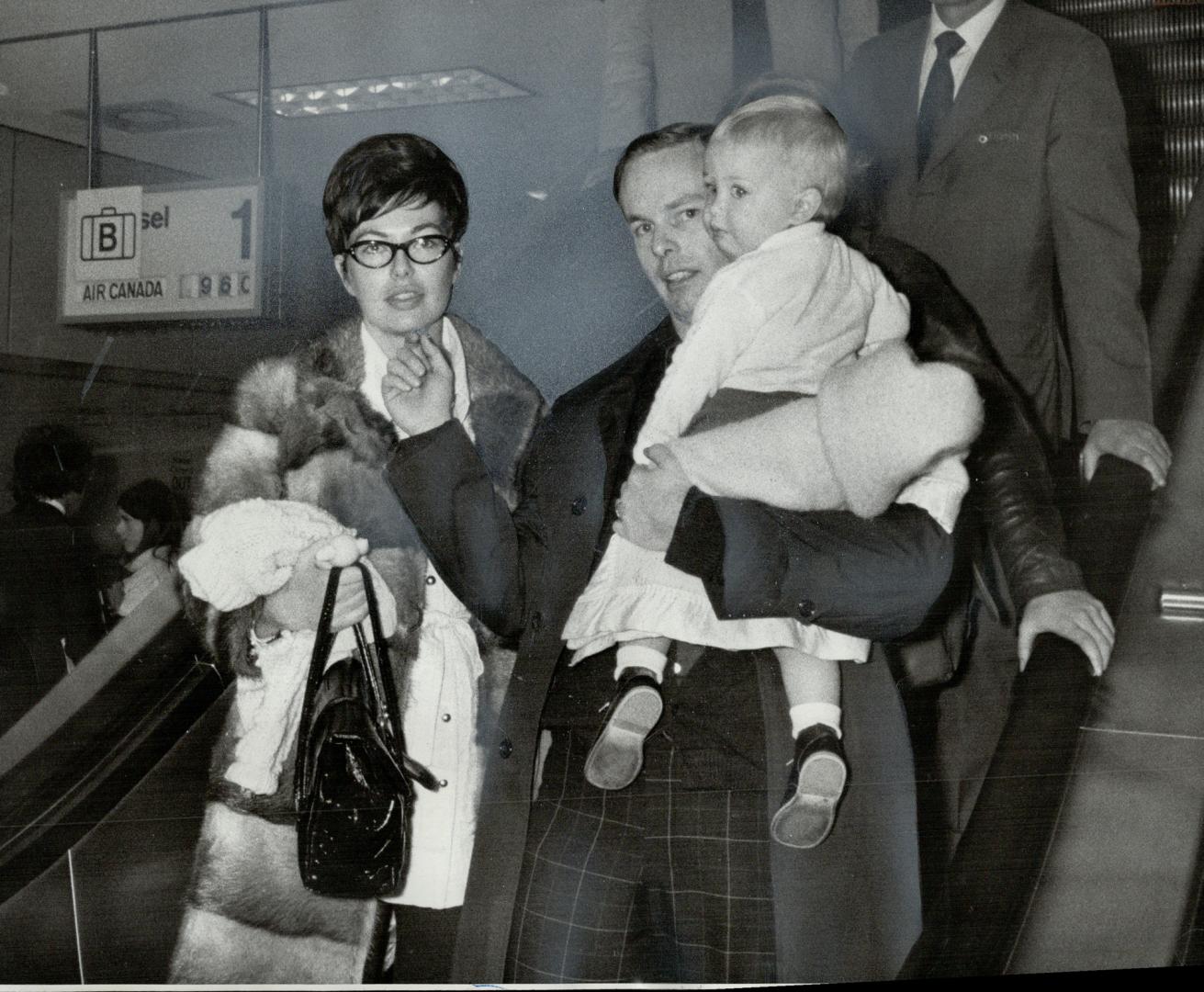 A tense vigil ends happily for John Nielson, 29, of Kitchener as he leaves Toronto International Airport today with his pregnant wife, Lynn, and his 1(...)