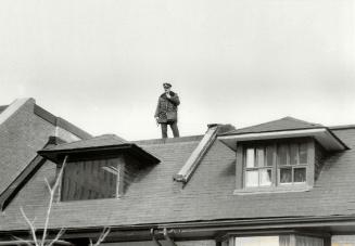 Police comb rooftops