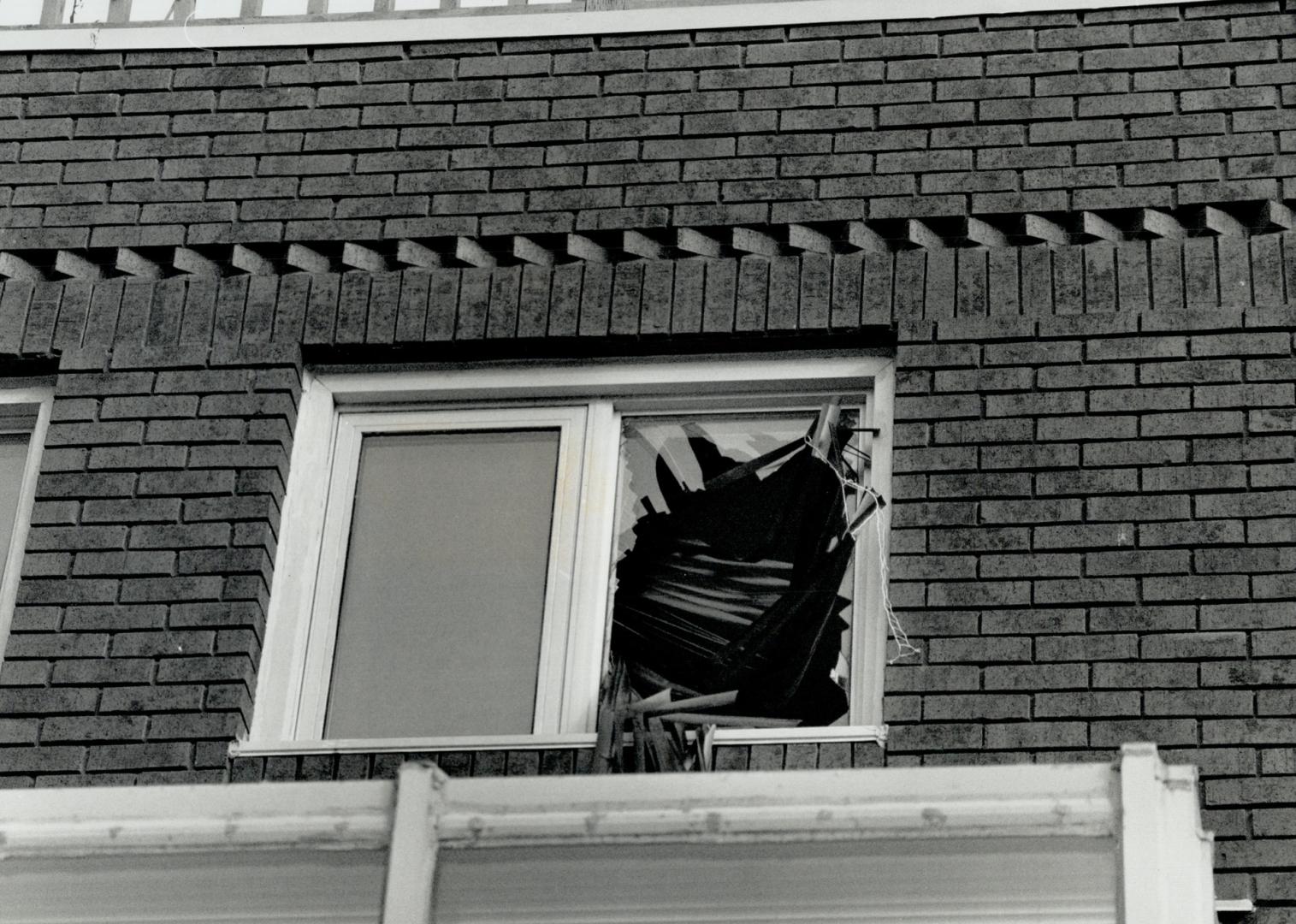 No escape from police, Ambulance attendants aid a man who plunged through a window in a McGill St