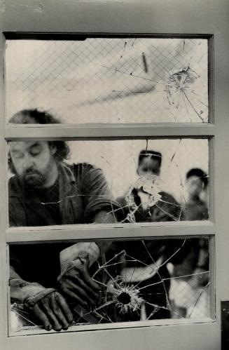 Shattered School, Andy Kemp, a Toronto Board of Education glazier, removes broken glass from Queen Alexandra senior public school on Broadview Ave. af(...)