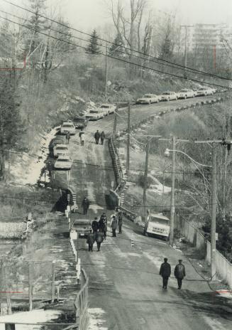 A road, closed for sewer construction, that crosses the grounds of Scarborough Golf Club was the scene of the murder early yesterday of Gordon Stoddar(...)